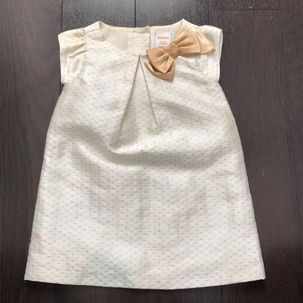 Cream and gold dress with bow detail